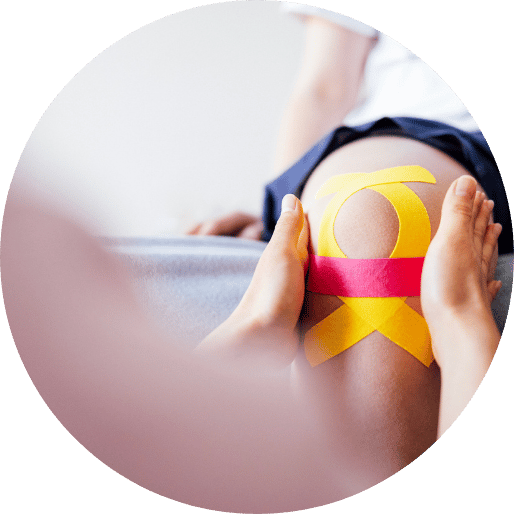 Person examining knee of patient