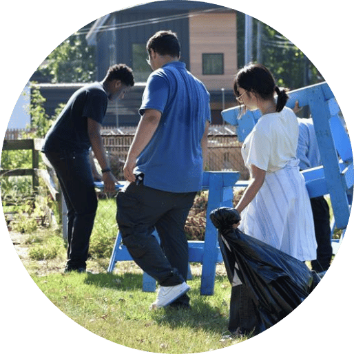 Students cleaning up outdoor space